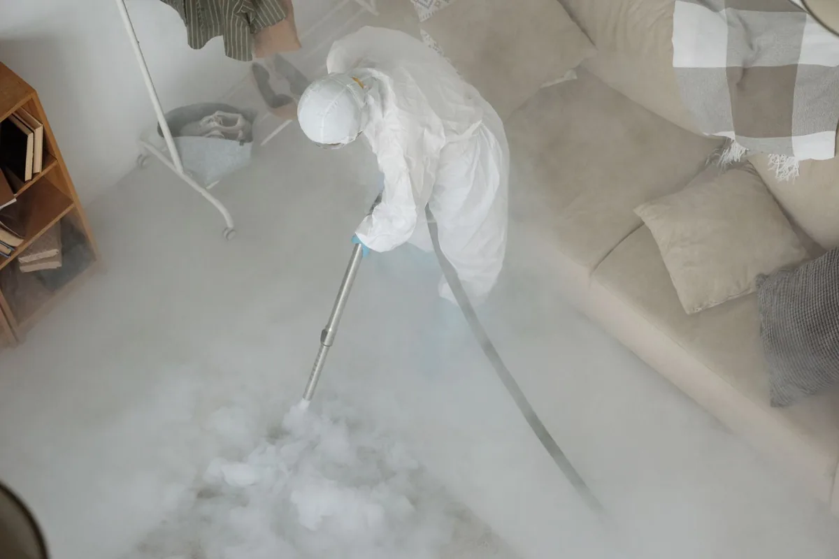 Biohazard cleanup technician in protective equipment, Lyndon, KY